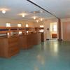 One side of the bunk room in Birch Lodge, with nine bunk beds lined up in two rows facing each other.