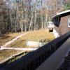 Birch Lodge exterior and yard. The yard behind the lodge includes walkways.