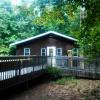 Birch Lodge's side entrance, including a wheelchair ramp and a deck.