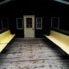 Two rows of yellow benches line Birch Lodge's deck.