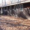 Maple Lodge exterior, featuring a wheelchair ramp. A ladder is propped up against the building.