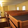 The top row of bunk beds in Maple Lodge with a dresser in front of each bunk bed.