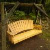 Wooden bench swing outside of Roth Cabin.